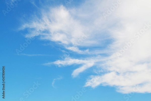 Fototapeta Blue sky on a sunny day, white clouds float by
