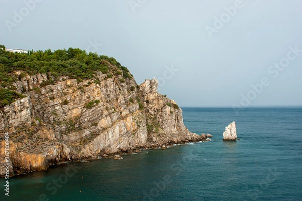 Fototapeta Rock "Sail" in the Crimea. View of the bay from the height of the cliff. Summer vacation concept.