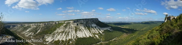 Fototapeta View of the mountain Besh-Kosh. View of the mountain valley at the foot of Chufut-Kale. A huge rock like a table and a green valley near it.