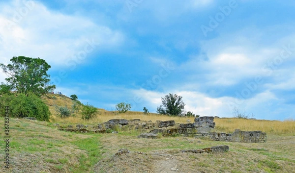 Fototapeta View of ruins with trees on a hill