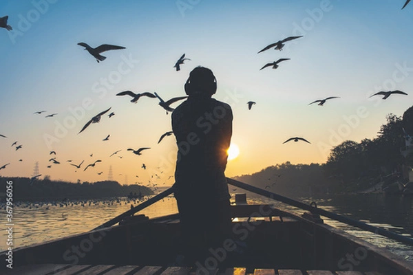 Obraz Man riding boat