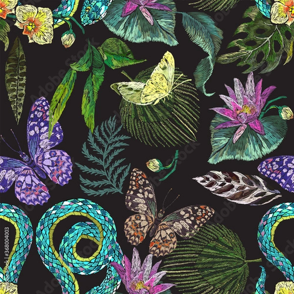 Fototapeta Embroidery with exotic floral pattern with butterflies, snake and tropical flowers. Vector seamless embroidered pattern for fashion design.