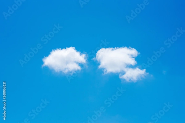 Obraz minimal nature white cloud on blue sky background in daytime, photo of nature cloud for freedom and nature concept.