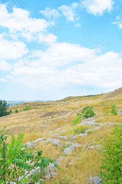 Fototapeta View of ancient stone ruins on a hill