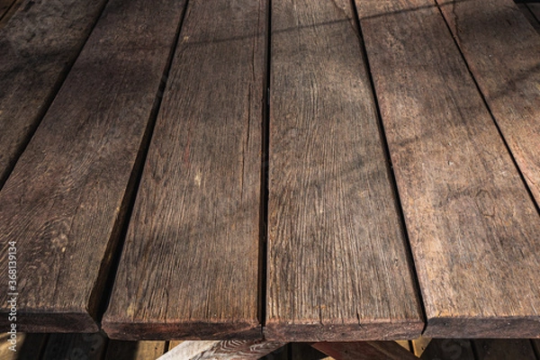 Fototapeta Wooden table top patio furniture. Edge of wood table. Weathered wood texture or background.