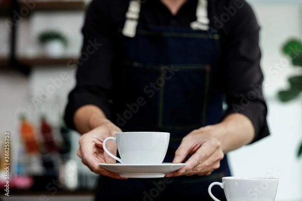 Obraz selective focus white coffee mug on hands
