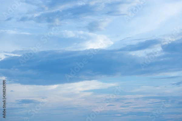 Obraz Blue sky background with tiny clouds.