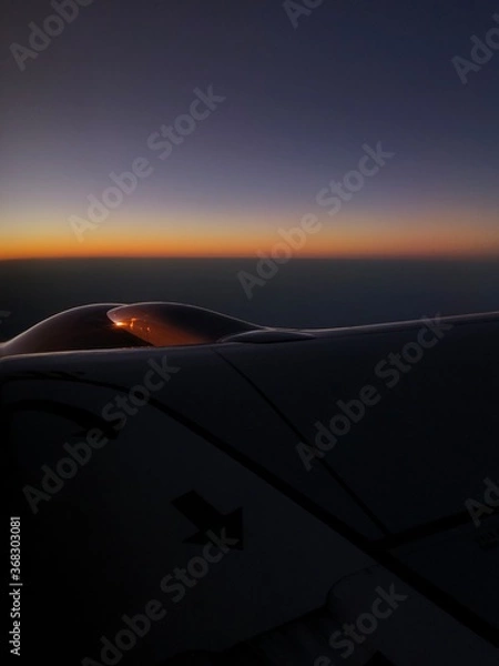 Obraz airplane in the sky sunset