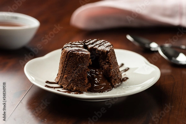 Fototapeta chocolate petit gateau and cocoa with hot melted inside