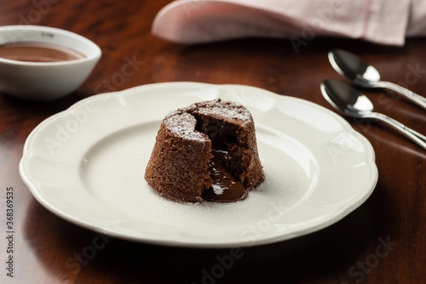 Fototapeta chocolate petit gateau and cocoa with hot melted inside