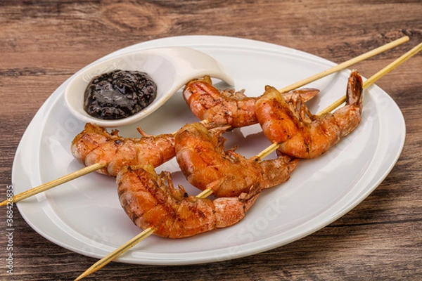 Obraz Grilled prawn skewer with pepper sauce