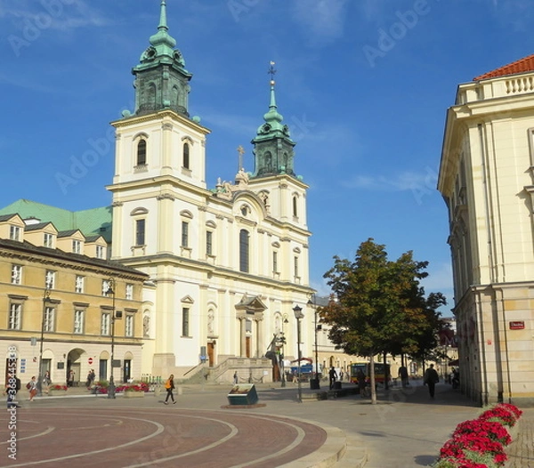 Fototapeta Warsaw, Poland -  area of Copernicus square opposite the building from the cathedral with crosses in the early morning