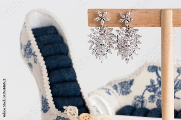 Obraz Close up of diamond earrings. space for your text.