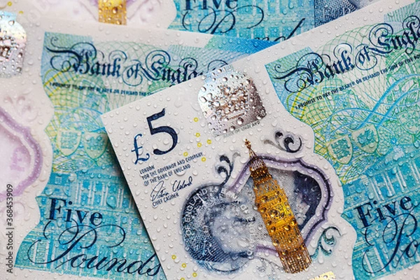 Obraz  British currency - close up of the new 2016 polymer five pound note with enhanced counterfeit resilience.