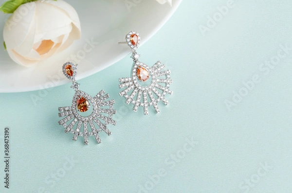 Obraz Close up of diamond earrings. space for your text.