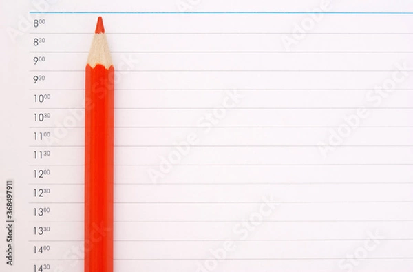 Fototapeta sharp red pencil on the schedule page