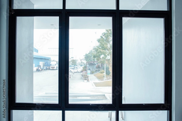 Obraz Green view beside window in office, Flare light through the window in the morning, Light sun shine from window