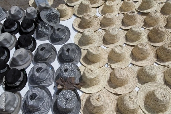 Fototapeta many different hats are lying on the ground
