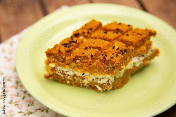 Obraz Pumpkin Kibbeh stuffed with ricotta cheese served on a green plate