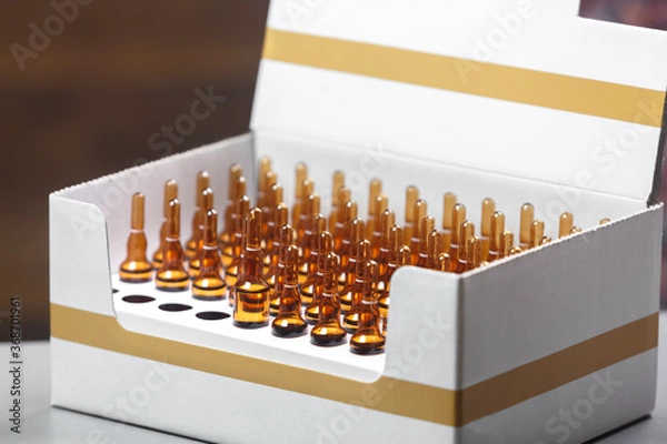 Fototapeta A set of ampoules for injection in a box.