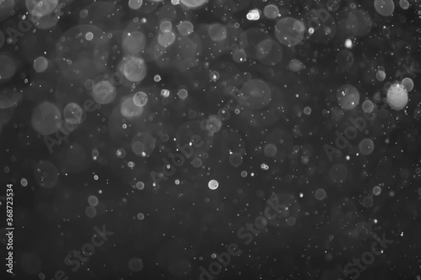 Fototapeta gray bokeh White and Silver lights on bokeh abstract background.