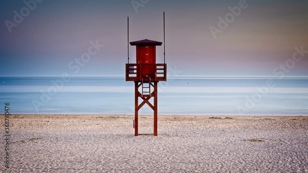 Obraz lifeguard tower on beach at sunset