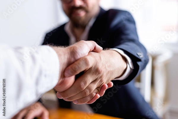 Obraz Businessman handshake close up.