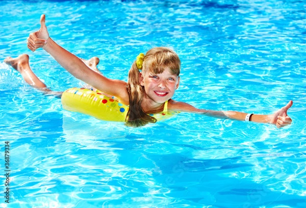 Obraz Child sitting on inflatable ring thumb up.