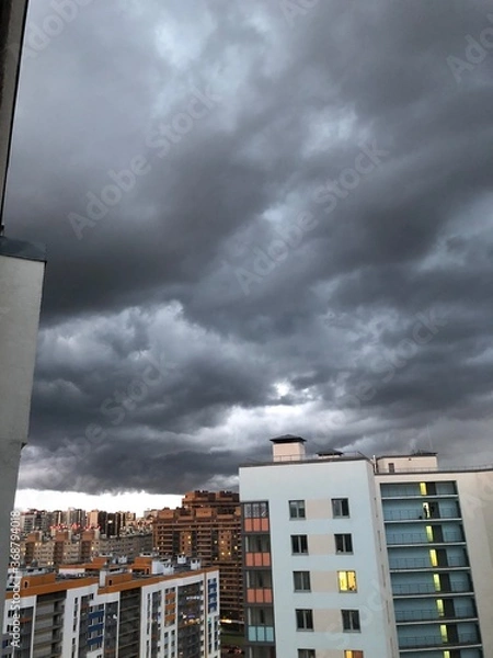 Obraz storm clouds over city