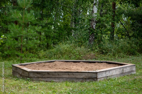 Obraz children's hexagonal big sandbox near the trees