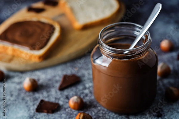 Fototapeta Chocolate hazelnut pasta with sandwich