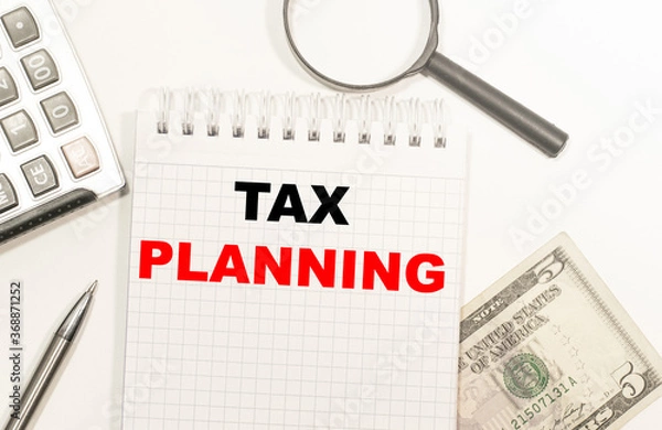 Obraz the text caption showing the tax deductions. Business concept writing for Finance input tax deduction of the money written on the Notepad, magnifier and dollars, calculator