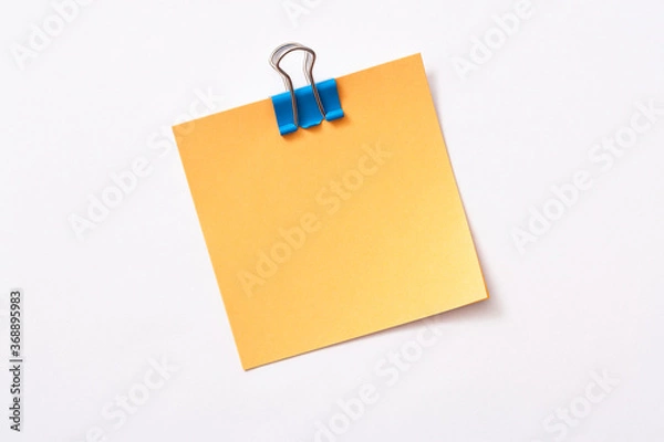 Fototapeta note paper and clip isolated on white background
