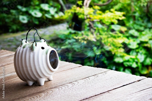 Fototapeta 日本の夏の風物詩　蚊取り線香の煙を吐く蚊遣り豚