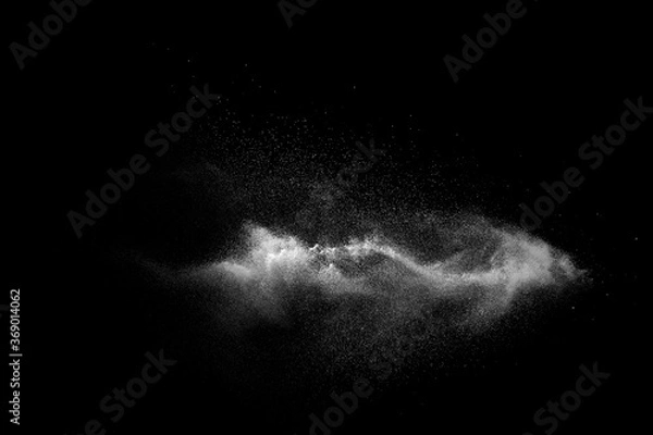 Fototapeta White talcume powder explosion on black background. White dust particles splash.