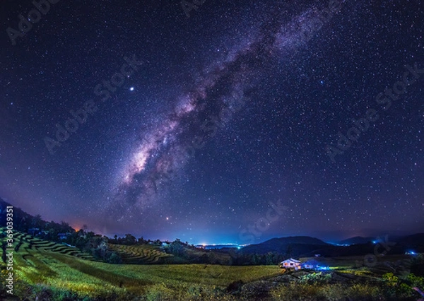 Fototapeta The Milky Way galaxy on the rice field on the mountain.Long exposure photograph, with grain.Image contain certain grain or noise and soft focus.
