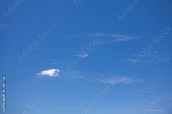 Fototapeta Feathery clouds in the sunny summer day