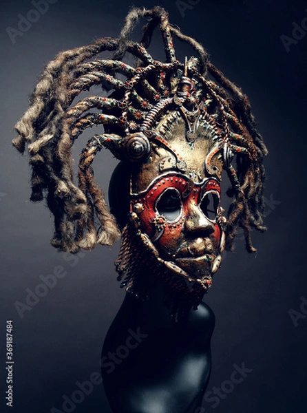 Obraz Creative african mask, dark studio background