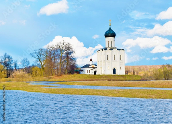 Fototapeta View of a Christian Church in a field near the river