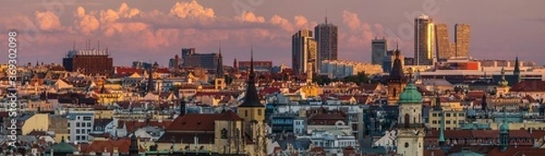 Fototapeta Panorama of Prague architecture against the backdrop of beautiful storm clouds