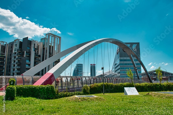 Obraz Modern cycle and pedestrian footbridge that connects Gino Valle square with the Portello park in Milan
