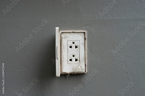 Fototapeta Asia plug socket. Plug socket on gray wall drak background