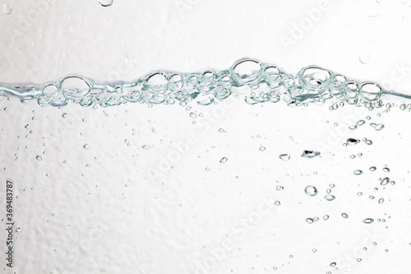 Fototapeta Closeup bubbles underwater on white background.