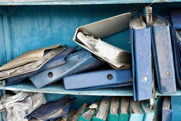 Obraz Damaged documents on old shelves