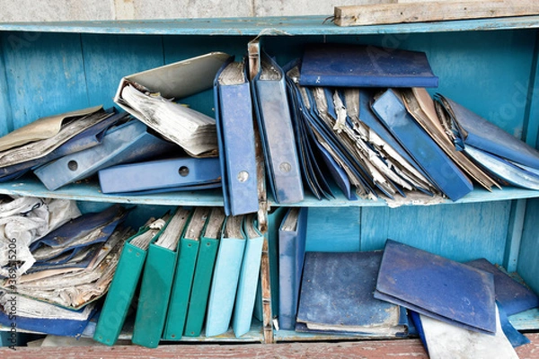 Obraz Damaged documents on old shelves