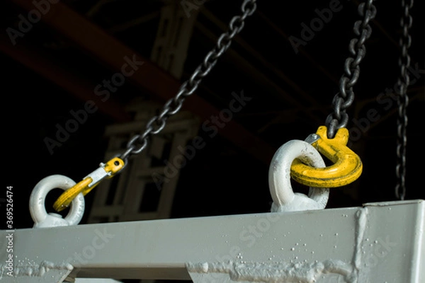 Fototapeta Transportation of cargo through the plant using a workshop crane.