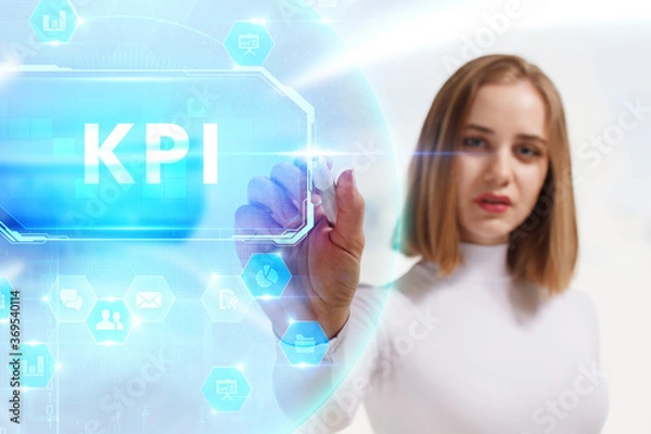 Fototapeta Business, Technology, Internet and network concept. Young businessman working on a virtual screen of the future and sees the inscription: KPI