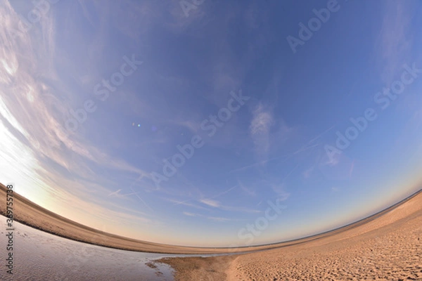 Fototapeta Distorted sea at low tide on a sunny day.