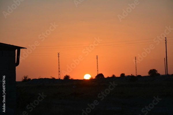 Obraz Sunset at vallage.