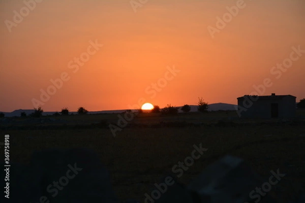 Obraz Sunset at village.